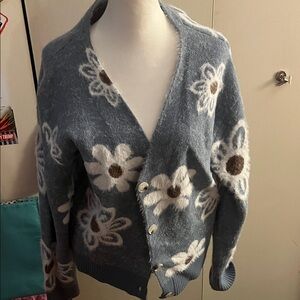 Blue Floral Cardigan Sweater. This will keep you nice and warm.
